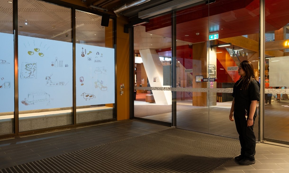 Person looking at projected artwork