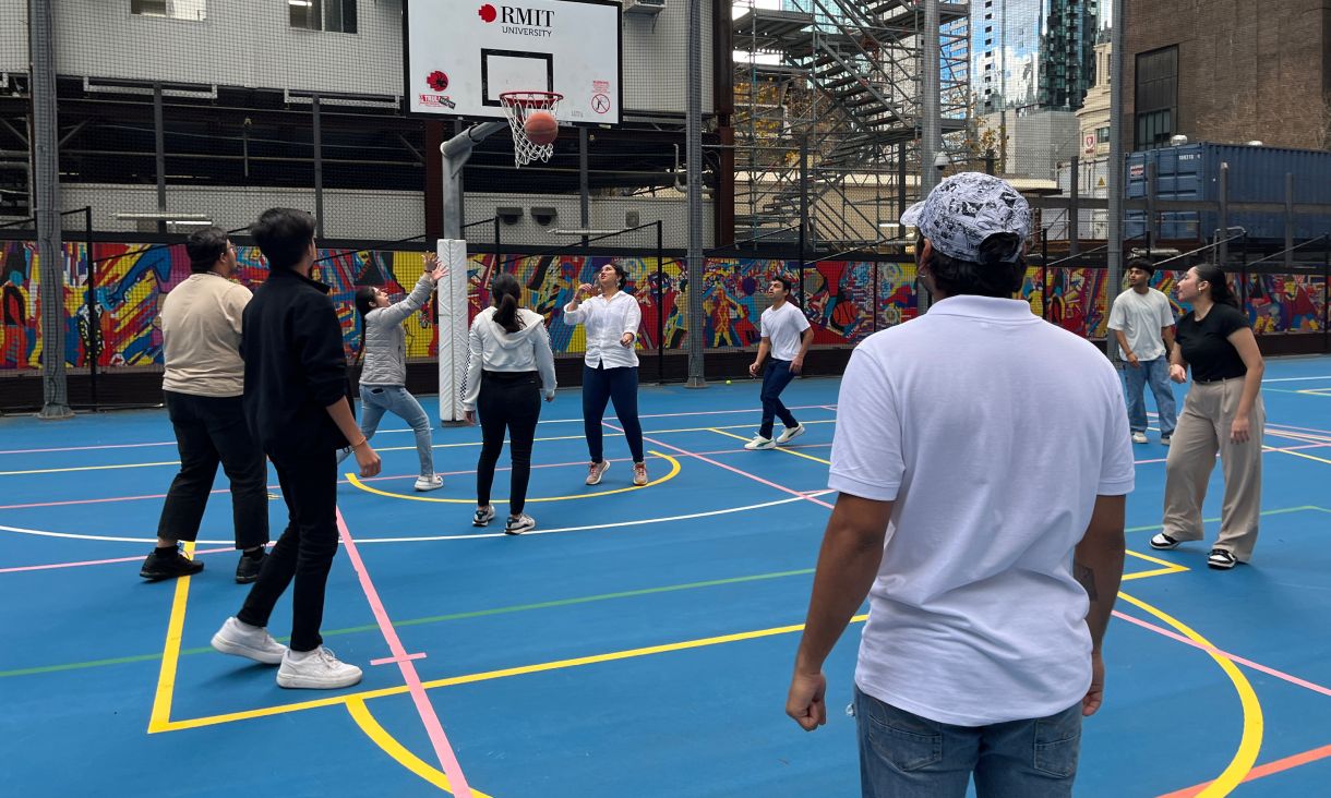 People playing basketball outdoors