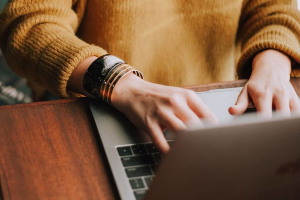 person typing on keyboard