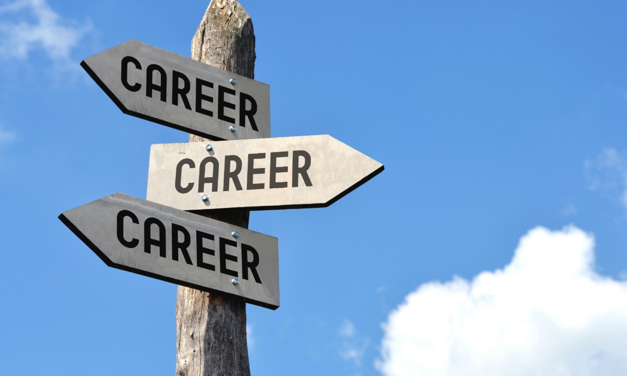 Post with three arrow signs which each read "career" pointing in different directions.