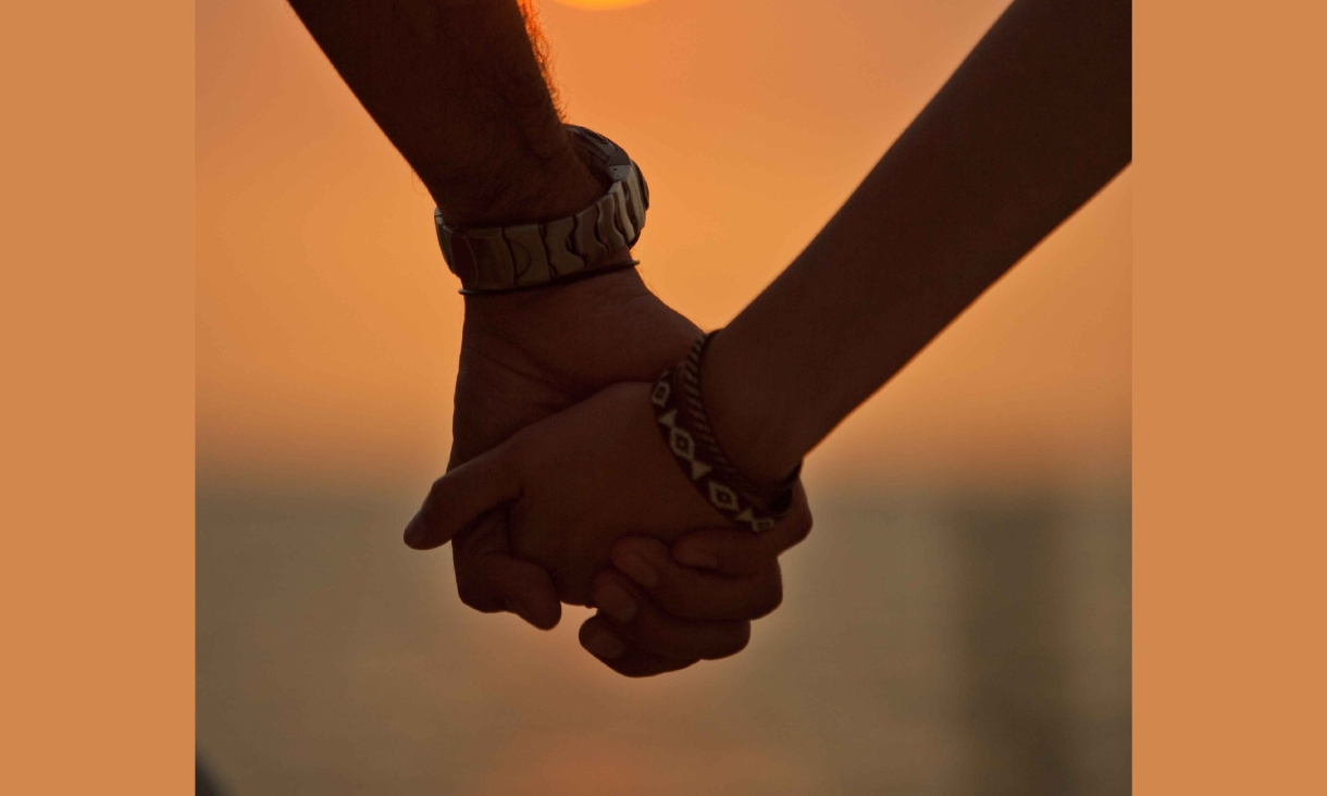 Close up of two hands being held