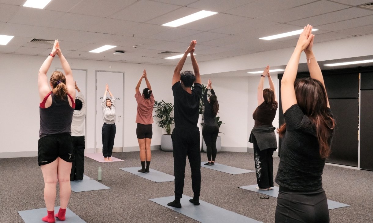 People doing yoga in studio