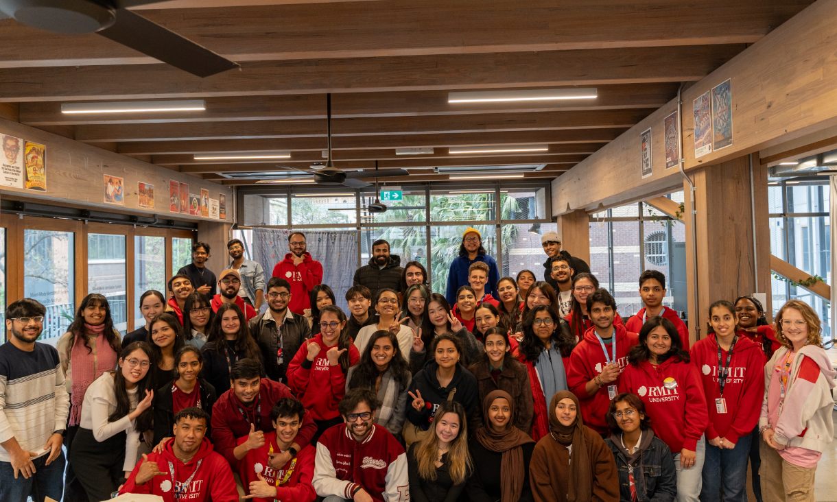 Group of RMIT Student Life Ambassadors posing together indoors at a campus space