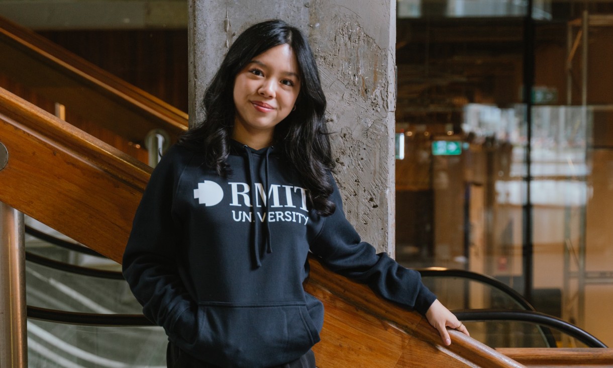 Person wearing the RMIT Store Essential Hoodie in navy