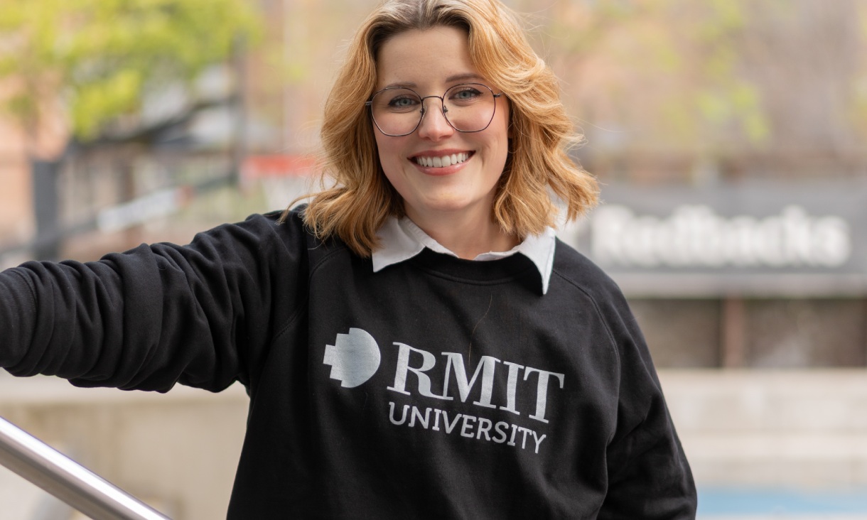 Person wearing the RMIT Store Essential Jumper in black