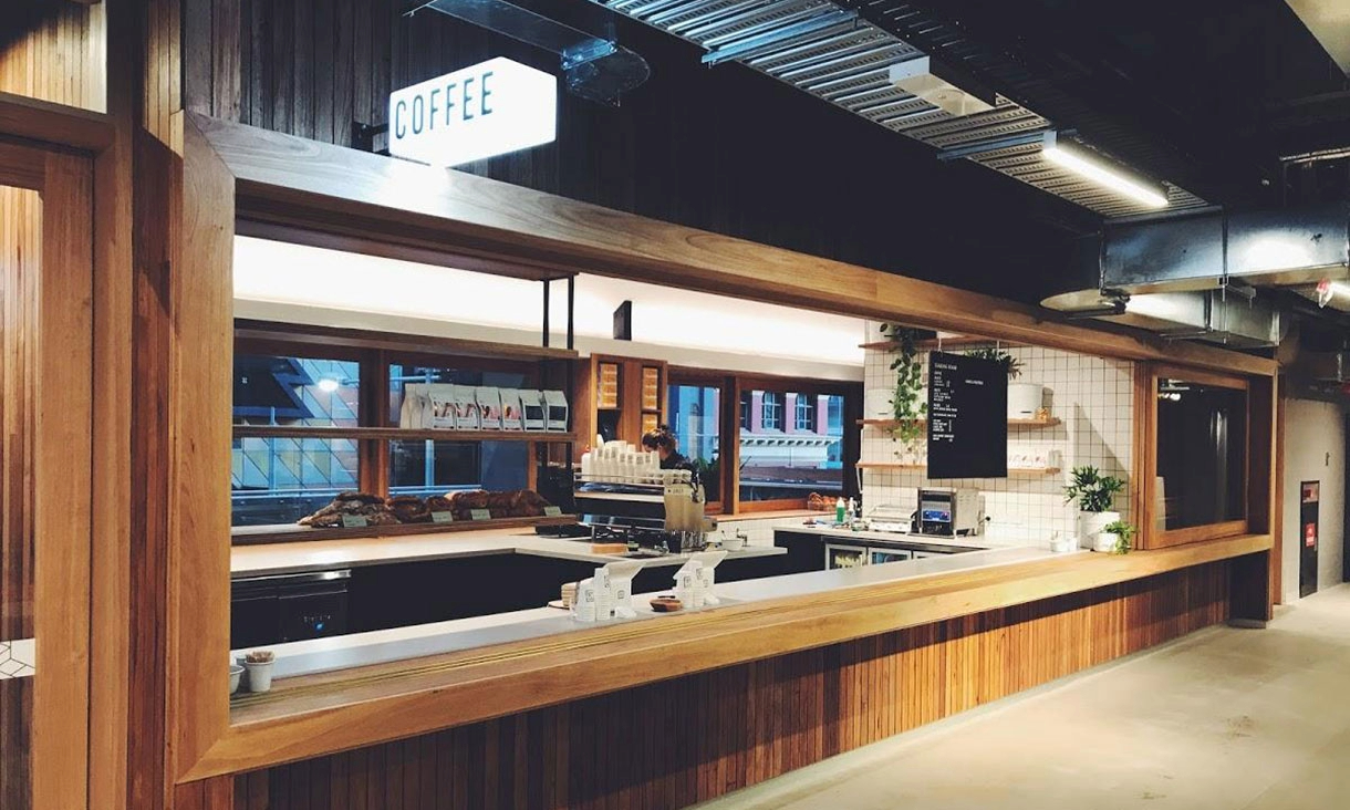 Timber-framed coffee counter in a campus café.