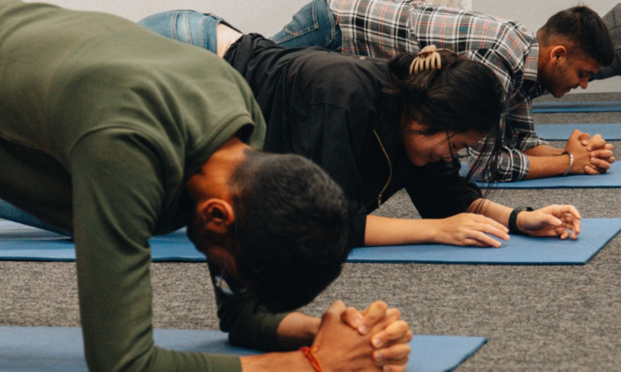 People doing yoga in studio