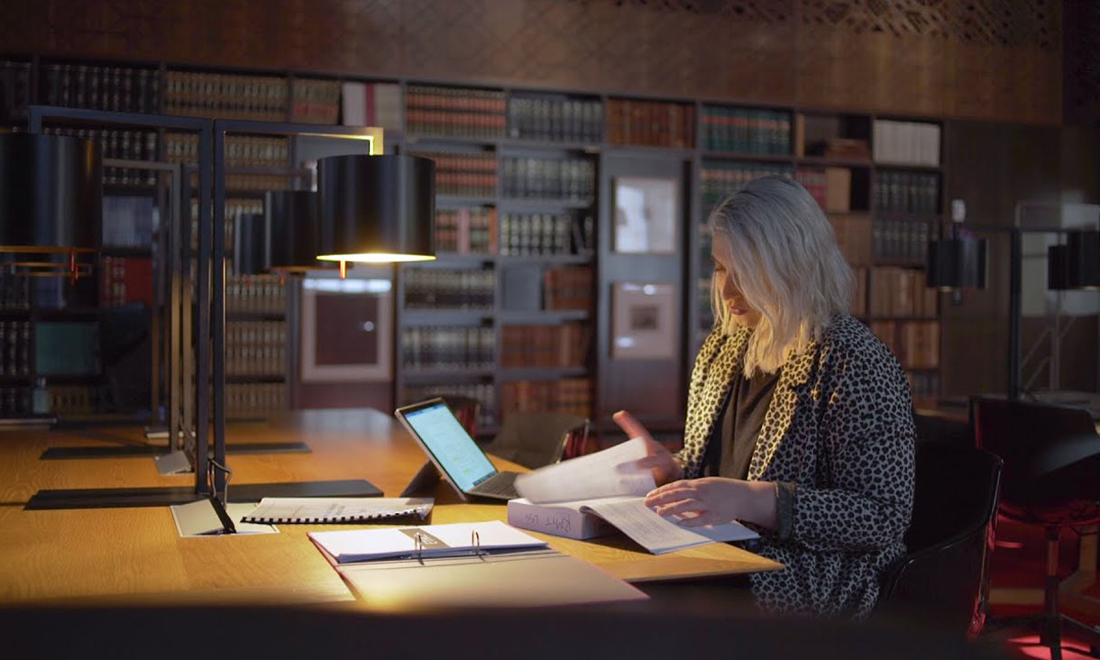 Woman studying in law library.