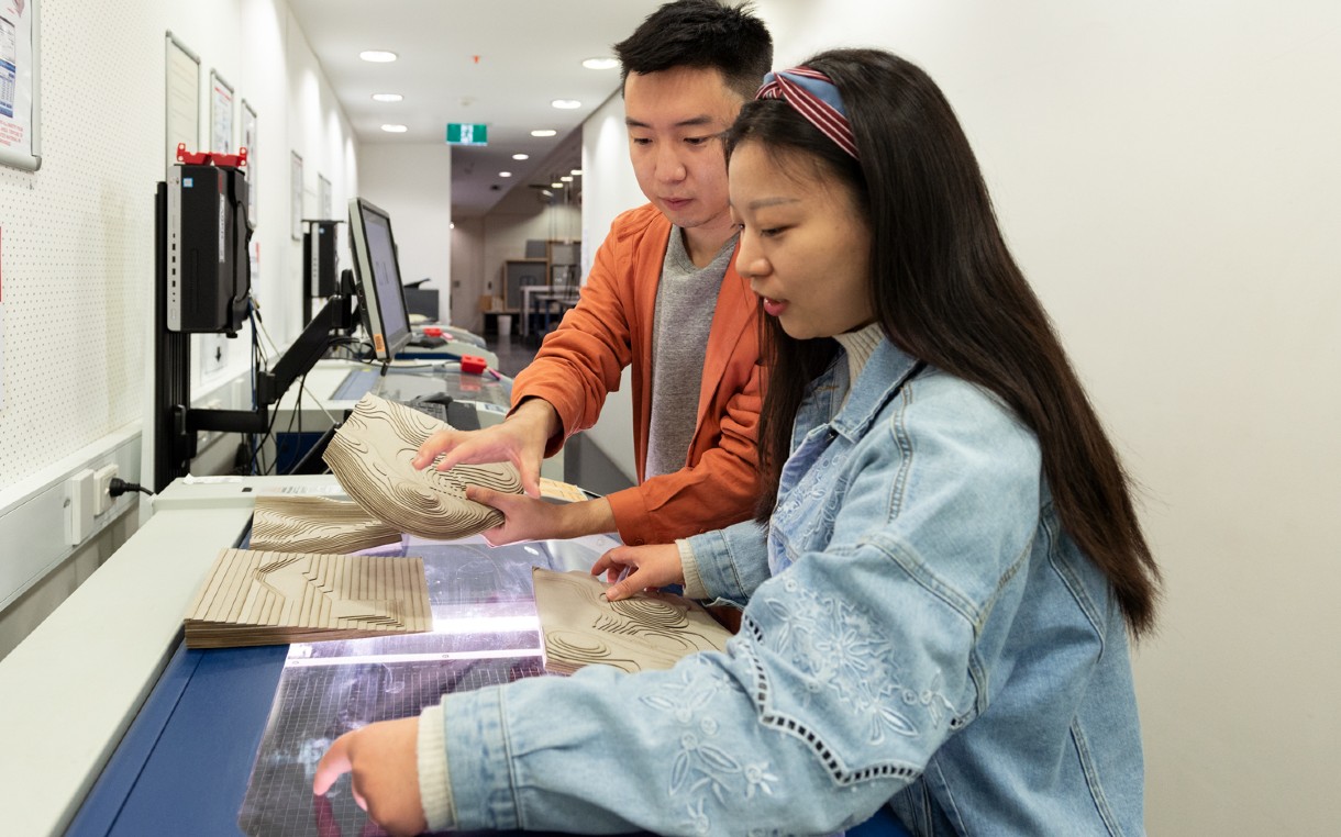 An RMIT landscape architecture student being shown a 3D landscape model