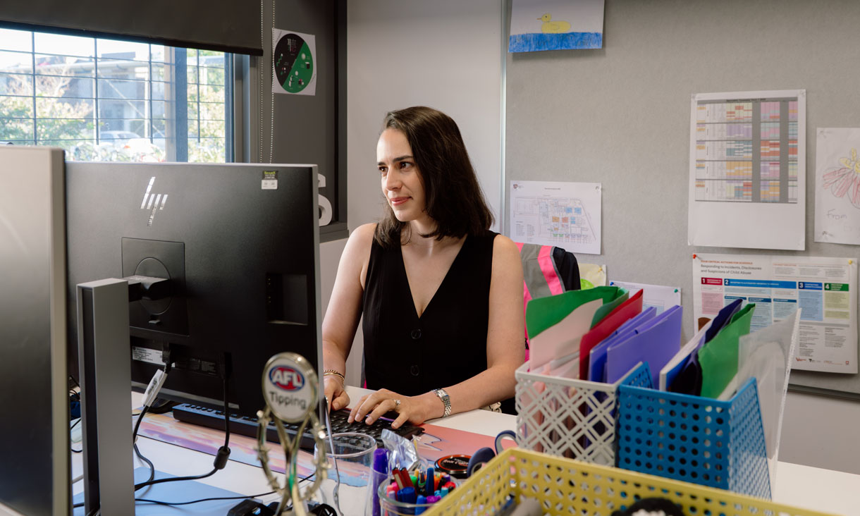 RMIT alumni Natalie Gelati working on a desktop computer