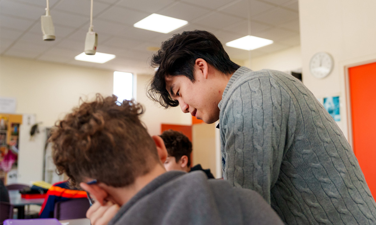 An RMIT Education helping a primary school student