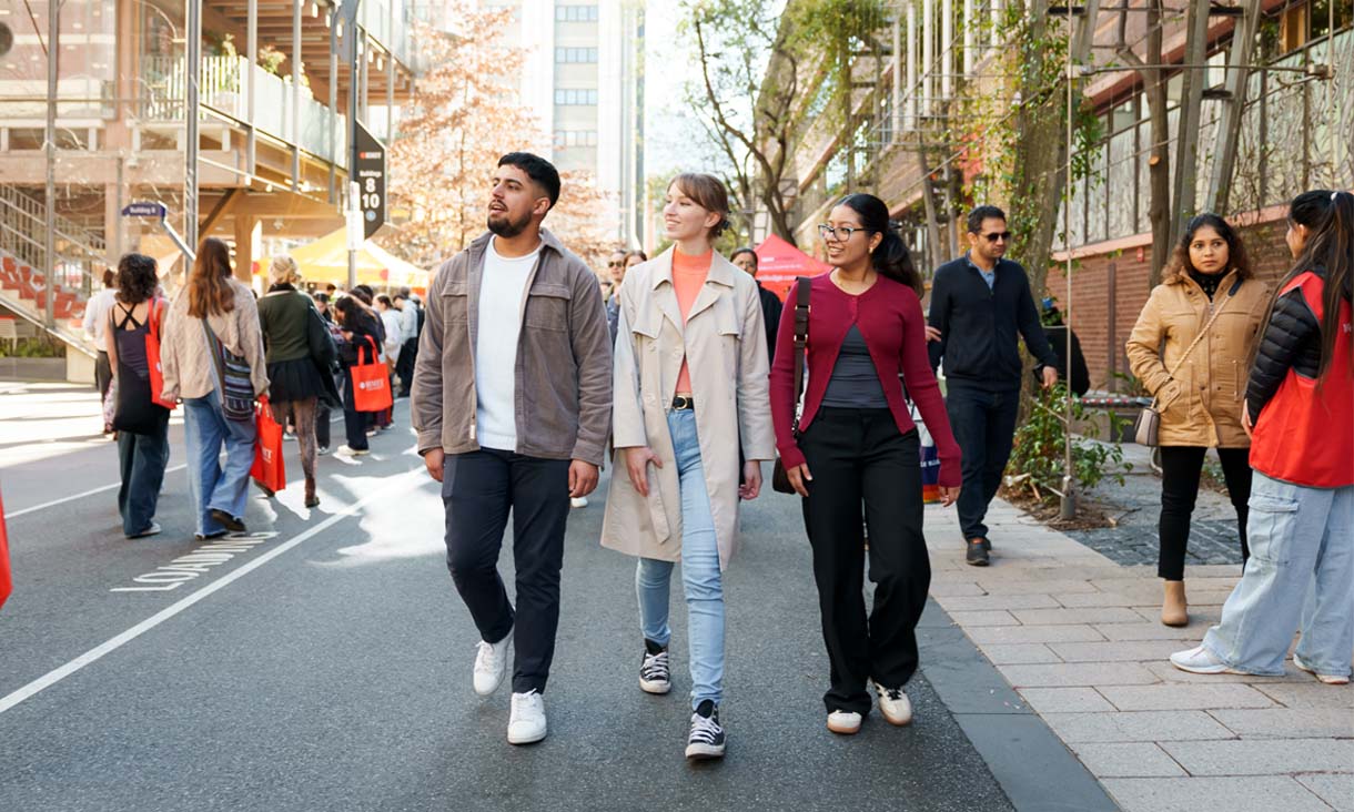 Three students exploring the RMIT City campus on Open Day