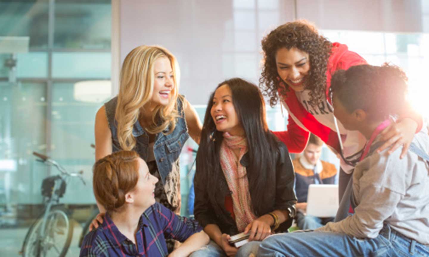 Group of students smiling and laughing.
