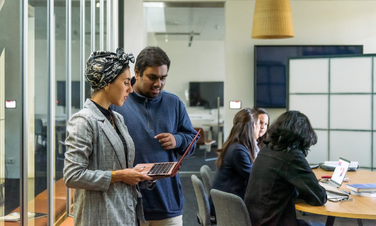 RMIT business students working on a group project together.