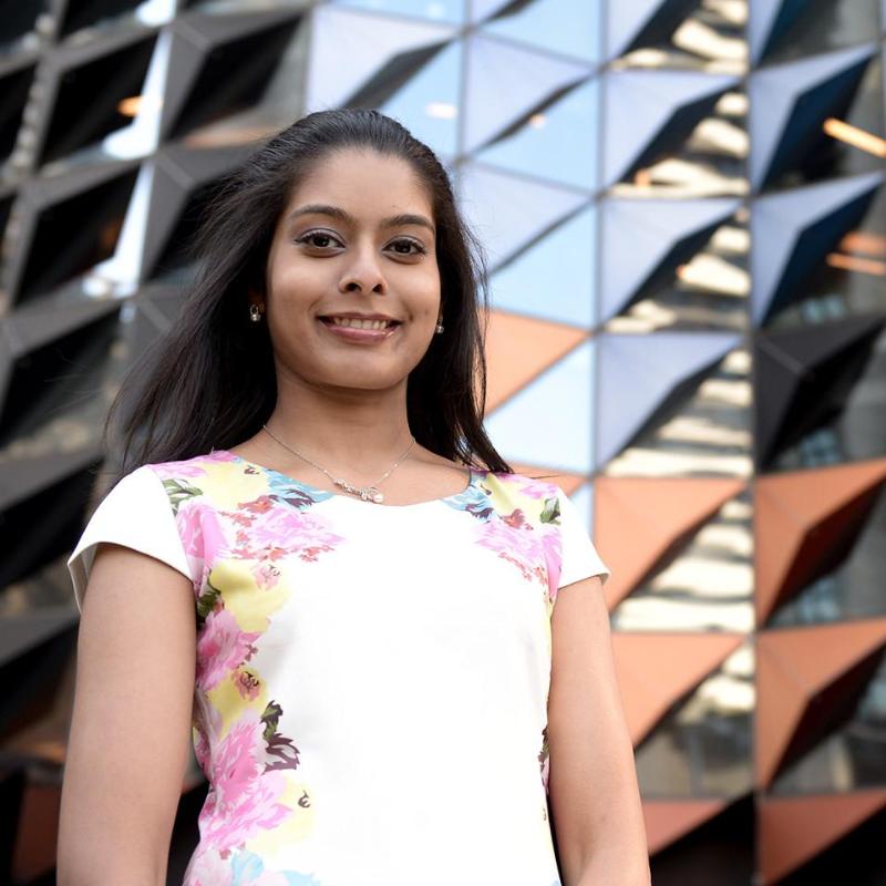 Student in front of Swanston Academic Building