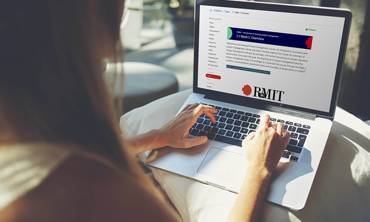 Female browsing RMIT online on laptop