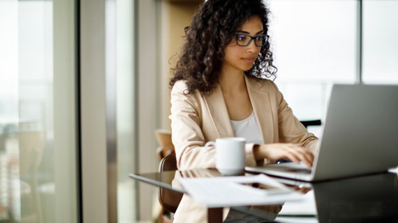 Young business woman working on laptop computer