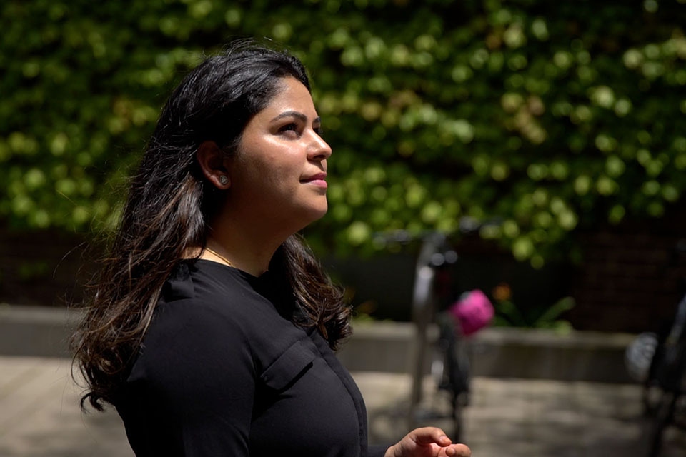 Female student looking ahead while outside campus