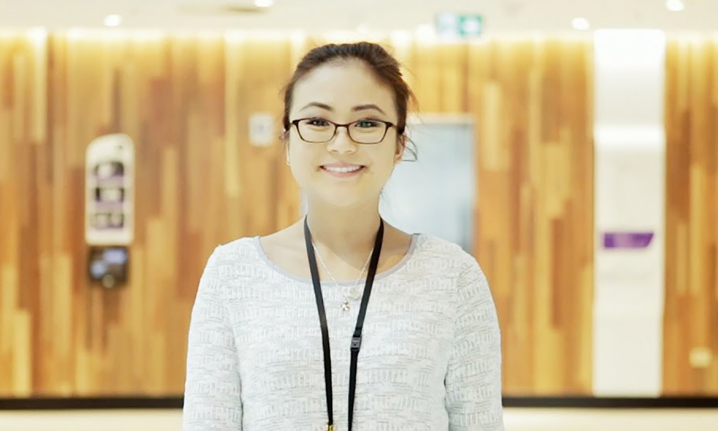 Woman in white shirt smiling