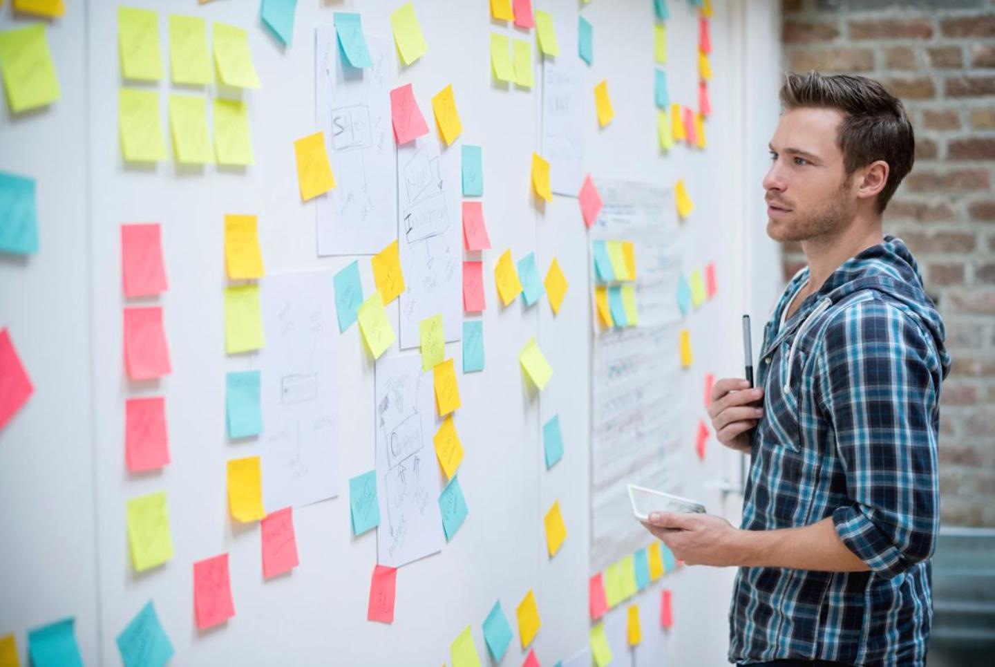 Man-look-at-board-with-post-its_iStock_000053140878-1440x865.jpg