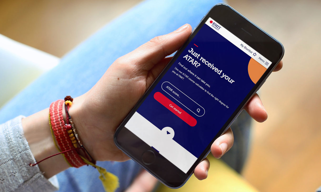 Hand holding phone displaying the ATAR course calculator