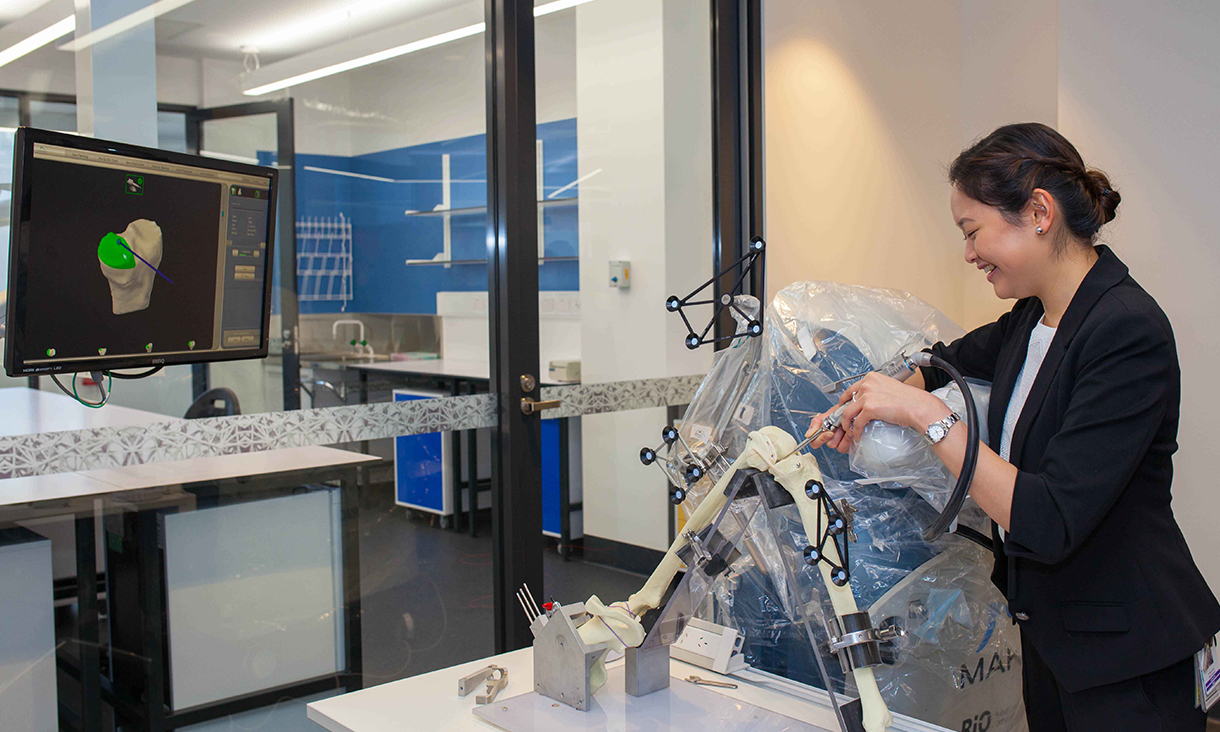 Young scientist using equipment in laboratory