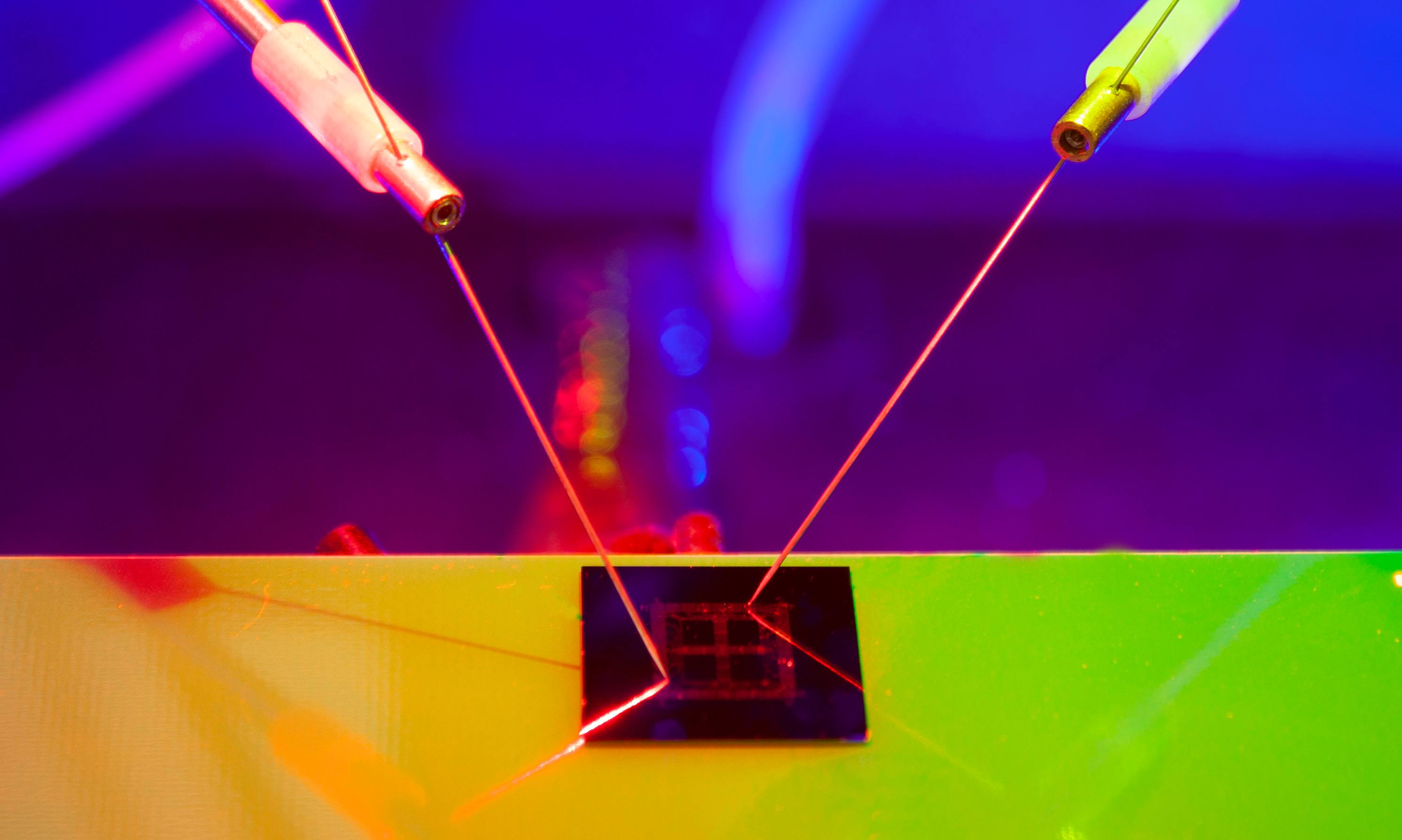 An electronic chip on a coloured background