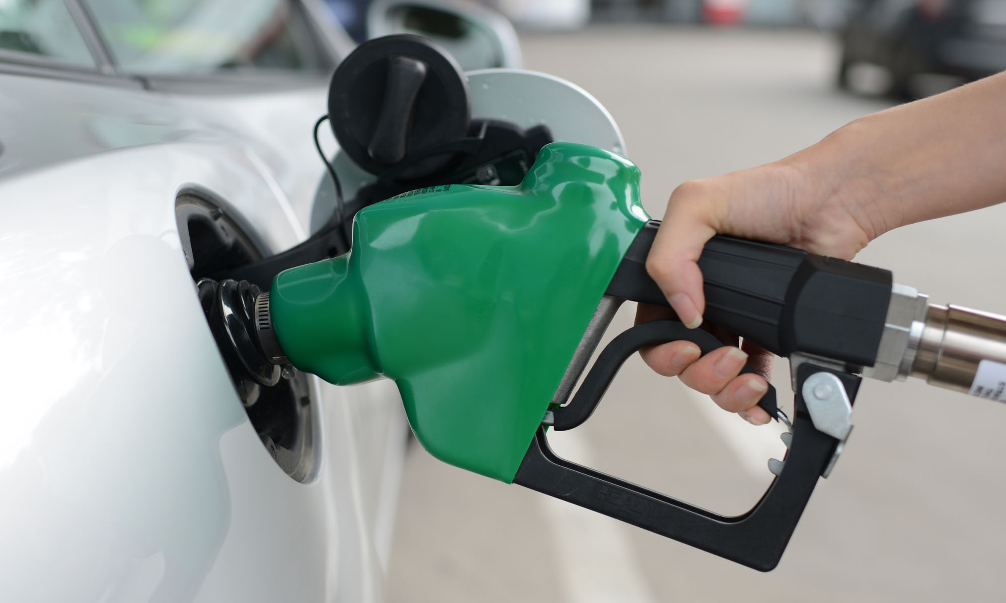 Petrol pump pouring biodiesel into a car