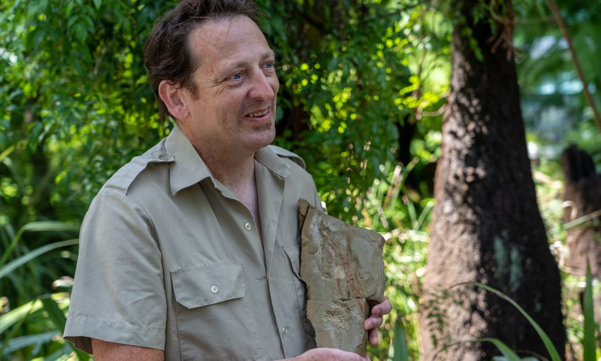 Fearghus McSweeney holding the fossil.