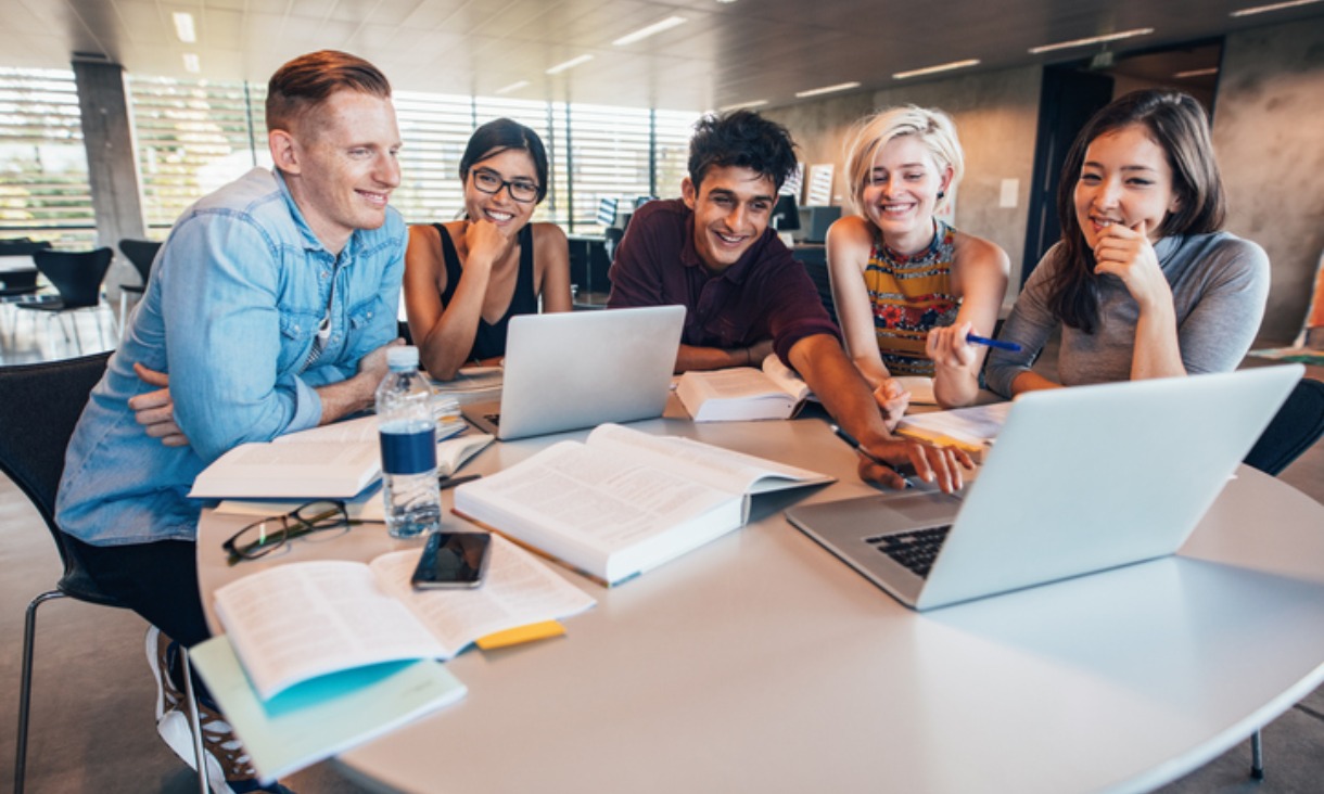 Group of students using laptops