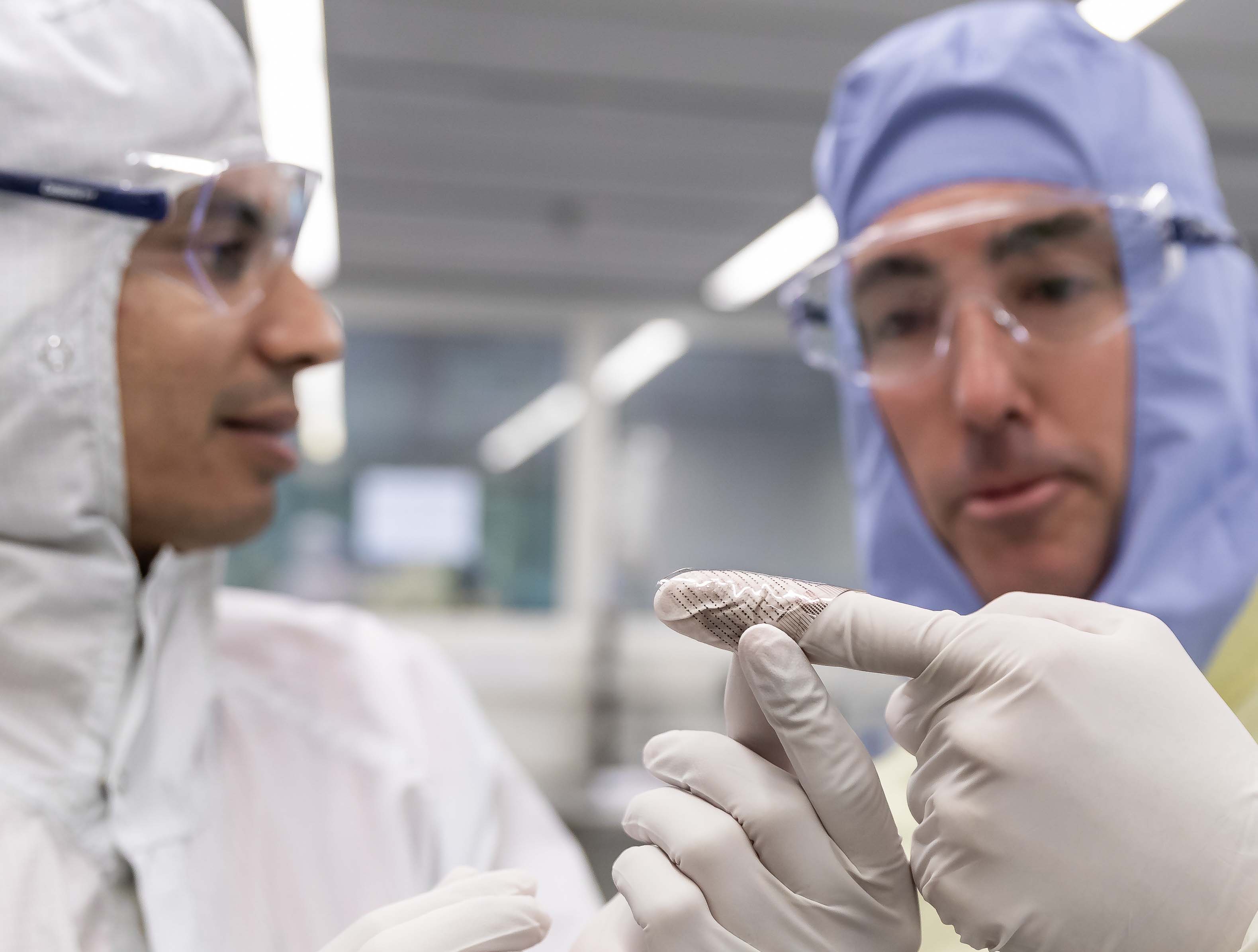 RMIT's Professor Sharath Sriram inspecting sensors in the lab with Sleeptite CEO Cameron van den Dungen.
