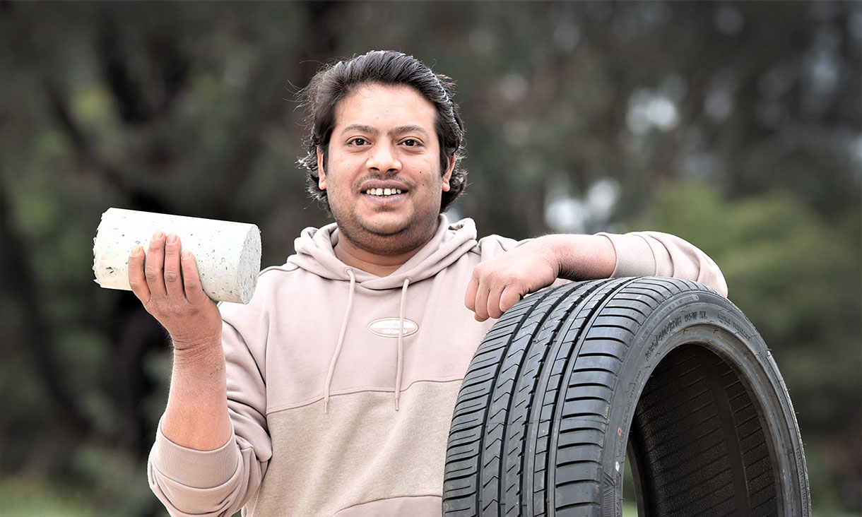PhD scholar Mohammad Islam with the team's concrete made with recycled rubber from used tyres. Credit: David Caird, Herald Sun