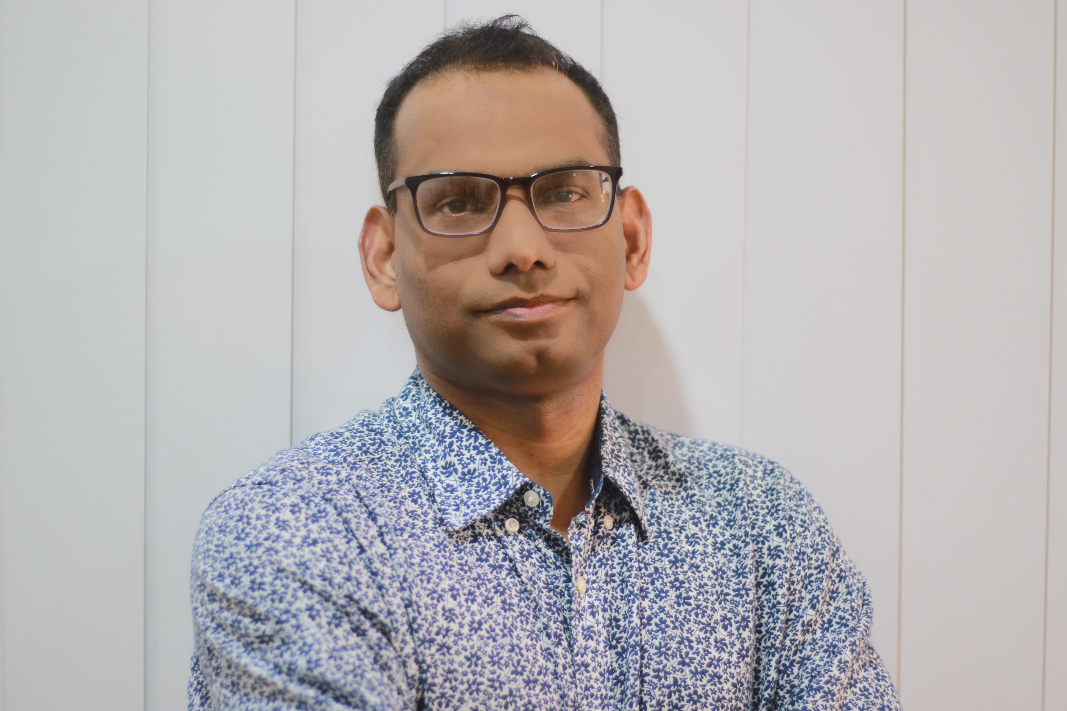 Headshot of Dr Mohammed Hossain looking at the camera