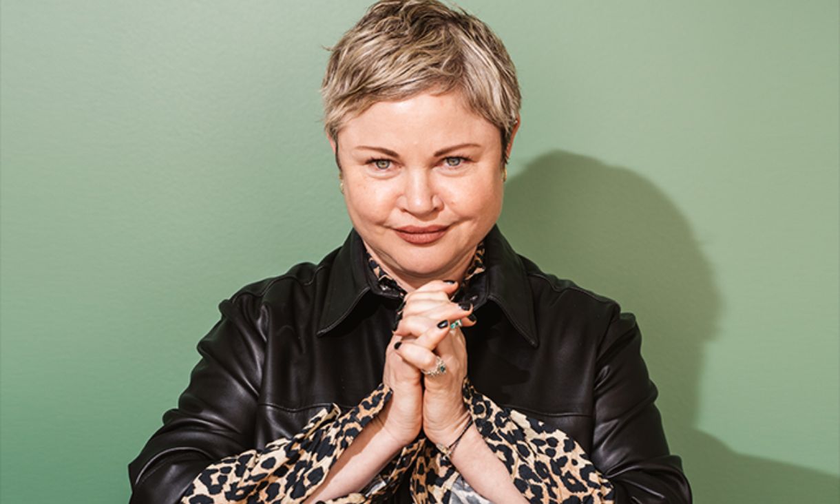 Cathryn Wills in front of a green wall