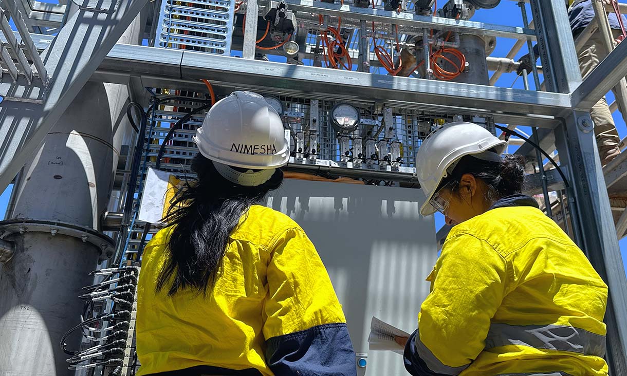 RMIT researchers inspect the operation of the PYROCO Mark 2 pilot unit at Melton Water Recycling Plant. Credit: Seamus Daniel, RMIT University 