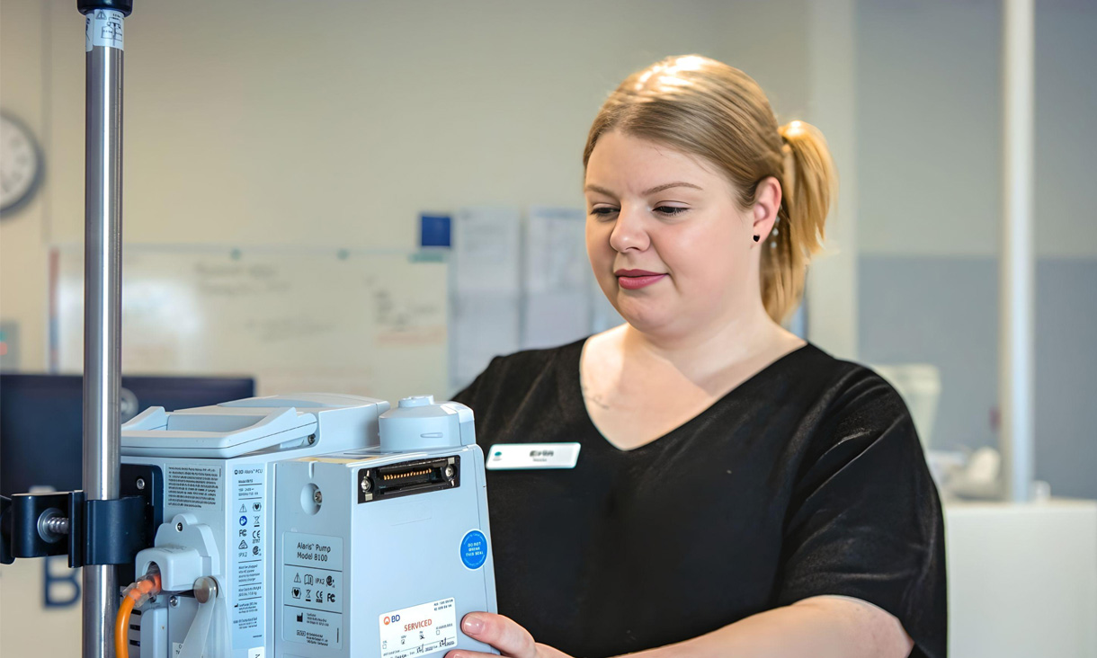 Nurse Erin Colgan wearing her 3D knitted scrubs as she works at the hospital.
