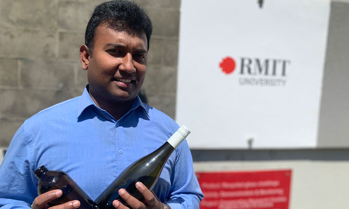 Associate Professor Dilan Robert in front of the team's building cladding display at RMIT's Bundoora campus. Credit: RMIT University