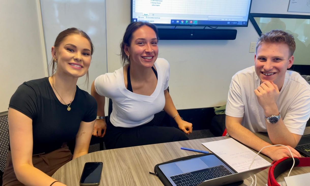 Paige Sobczyk providing mentorship to two students