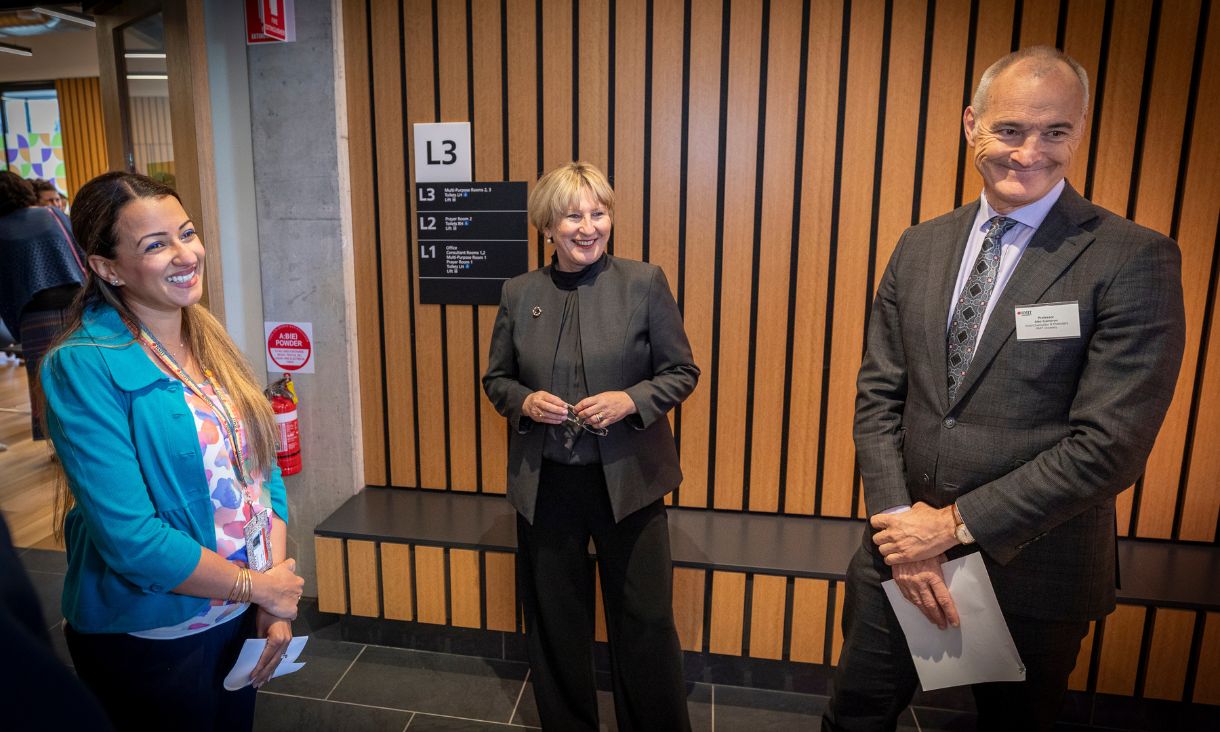 RMIT vice-chancellor inside the facility with wellbeing staff and student