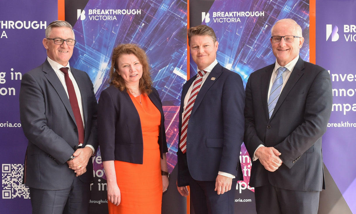 Breakthrough Victoria CEO Grant Dooley, Breakthrough Victoria Executive Director Pre-Seed Olga Hogan, Minister for Industry and Innovation Ben Carroll and Deputy Vice-Chancellor Research and Innovation and Vice-President Professor Calum Drummond (AO) standing in front of Breakthrough Victoria's pull up banners