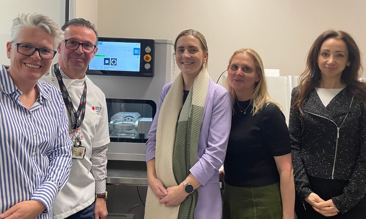 RMIT team pictured next to new wet mill machine.