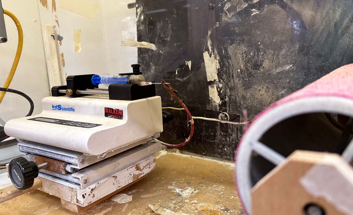 The electrospinning machine used to create nanofibers, which were bonded to cotton. 