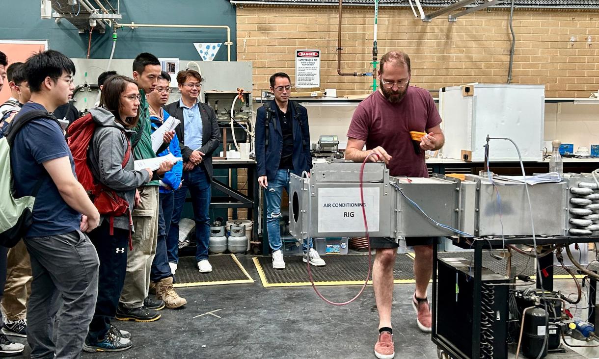 Students watching a lab demonstration.