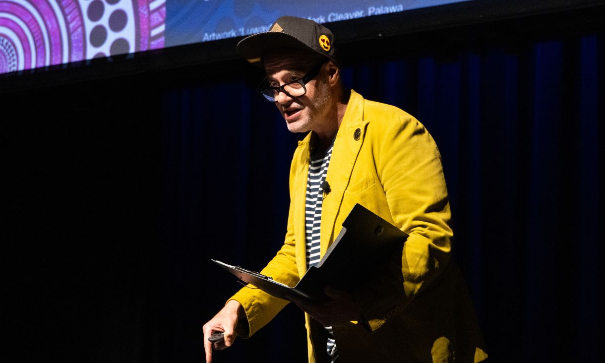 Host Adam Spencer delivering opening remarks on stage