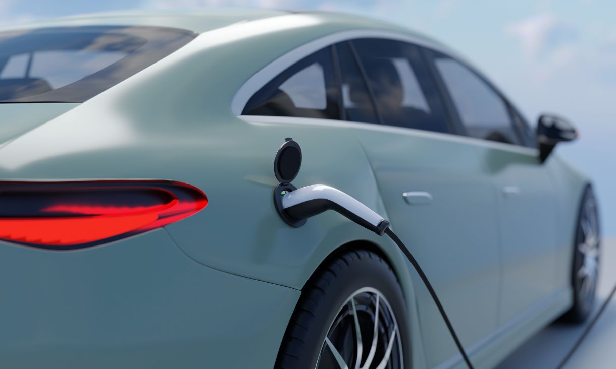 Electric vehicle plugged into charging cable