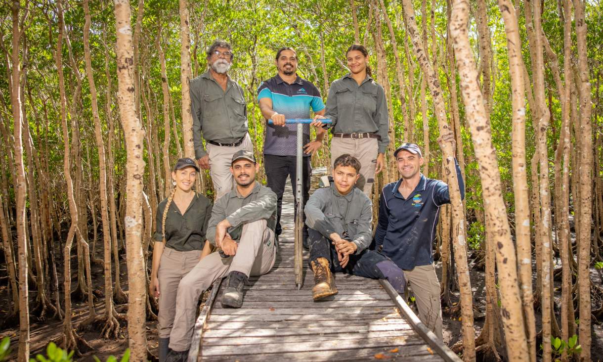 Joint fieldwork team measuring carbon sequestration in the mangroves around Cairns Airport. Back row: George Singleton, Gavin Singleton, Ashlyn Skeene. Front row: Lucy Friend, Tarquin Singelton, Mathew Skeene, Peter Macreadie. Credit: Through The Looking Glass Studio.