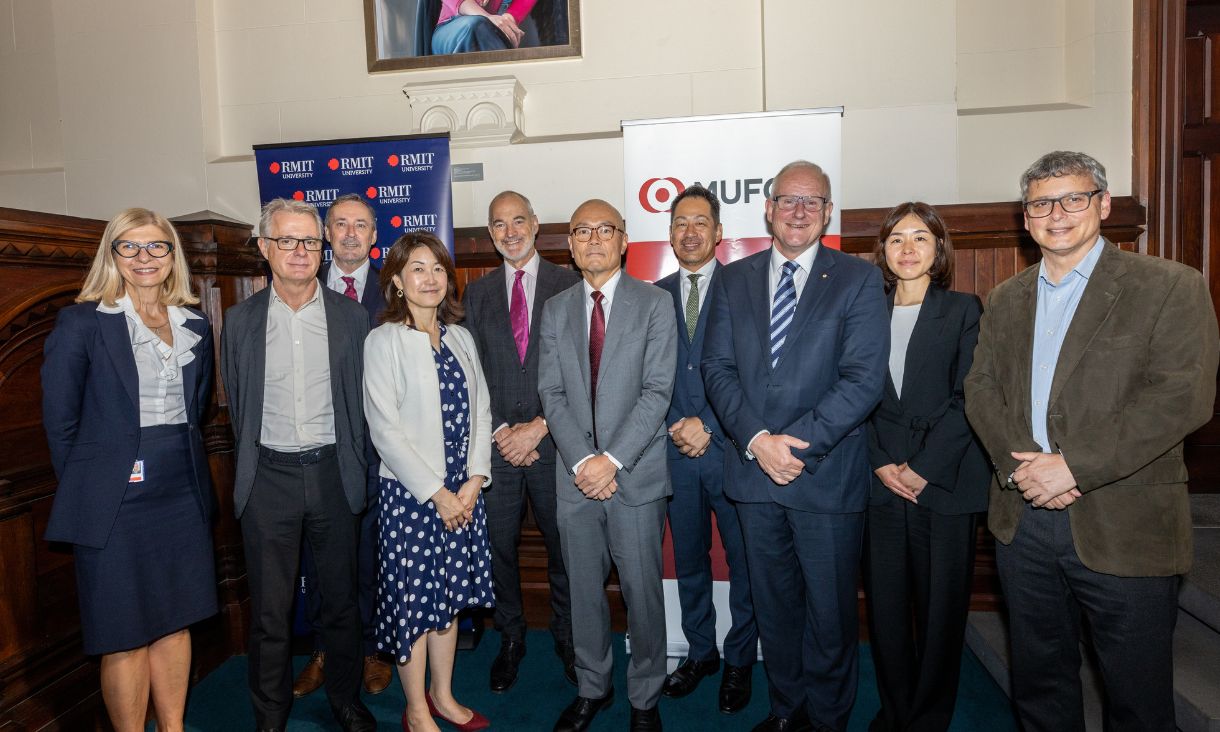 RMIT and MUFG leaders smiling at camera