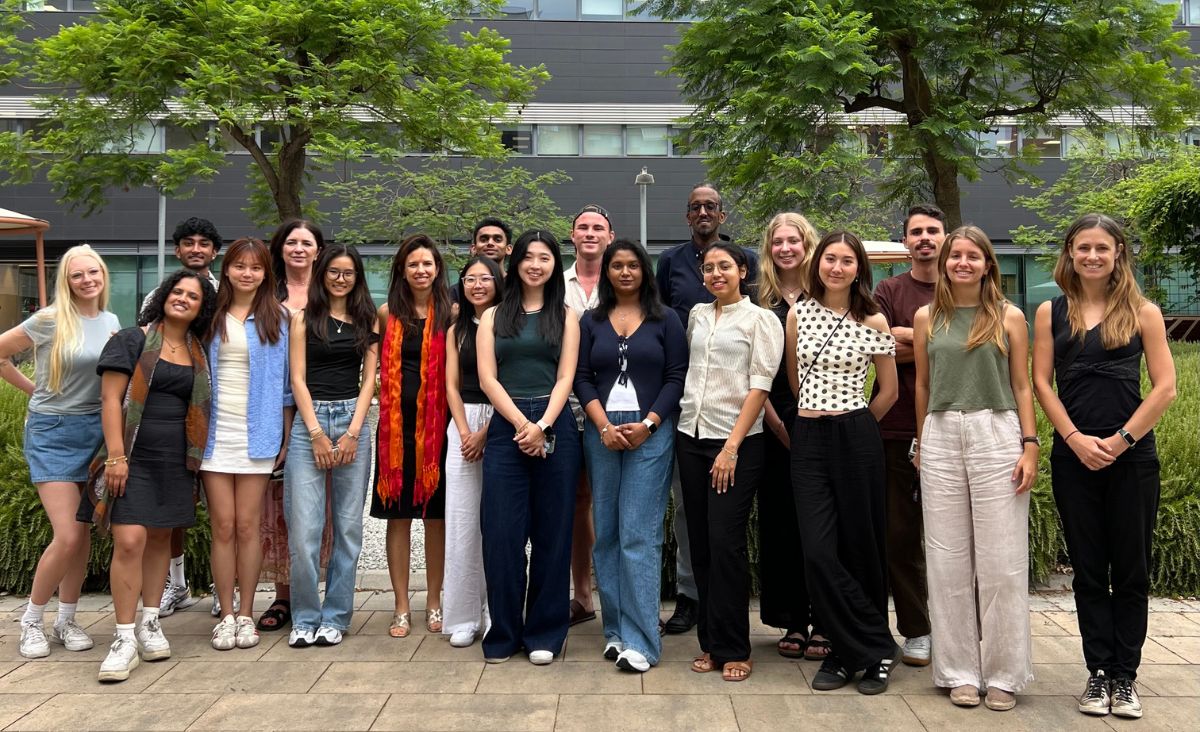 RMIT Europe Executive Director Marta Fernandez (centre, wearing red scarf) welcomed students from Australia and Singapore at the RMIT Europe office in Barcelona. 