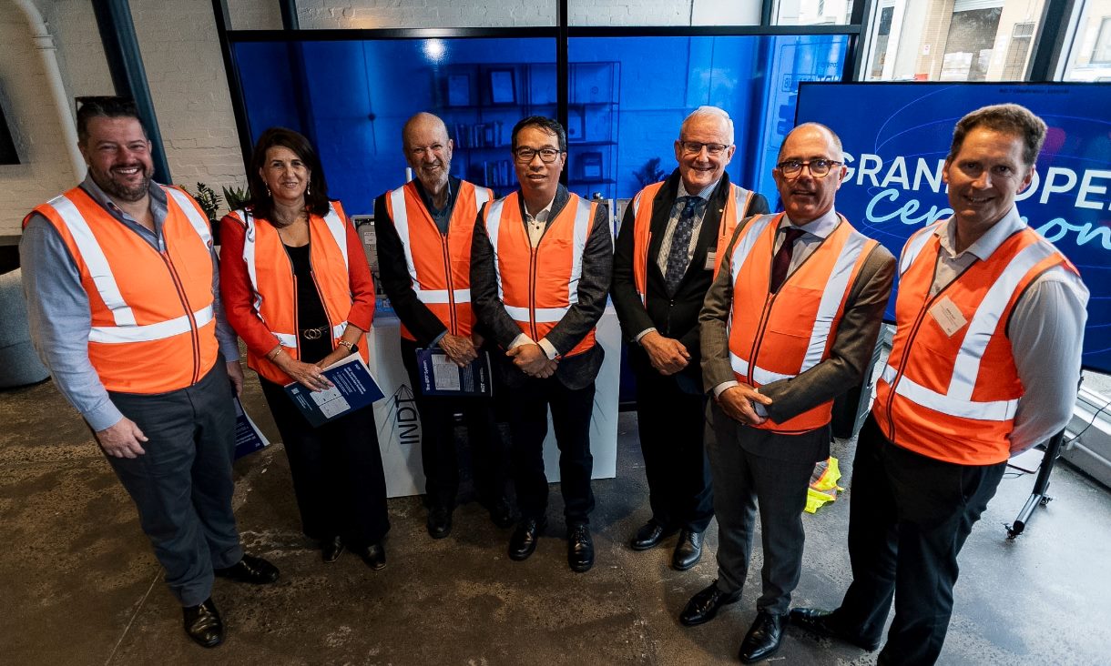 A photo of seven people in high-vis jackets.