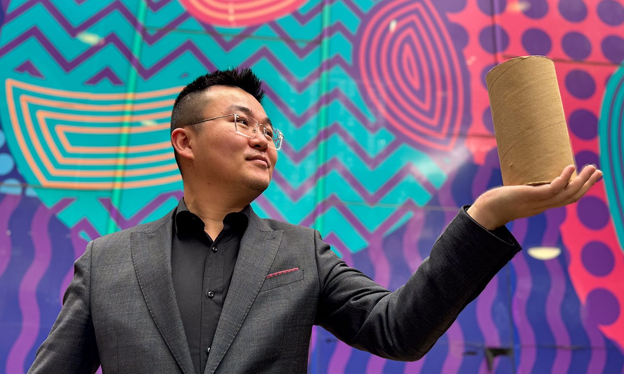 Study lead author Dr Jiaming Ma holding the cardboard-confined rammed earth material.